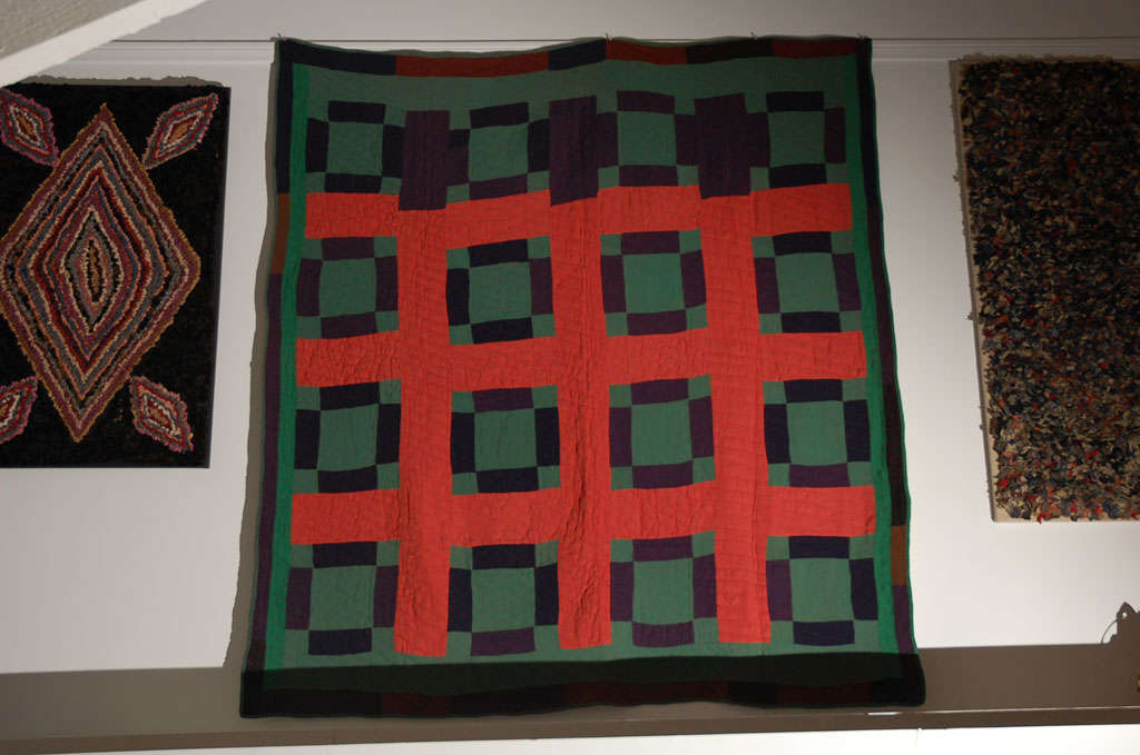 Amish wool western PA geometric nine patch quilt. This folky example has one patch brick border on all four sides. This very quiet well with Folk Art. This quilt is in great condition and works quite well with other Folk Art. It has simple reddish