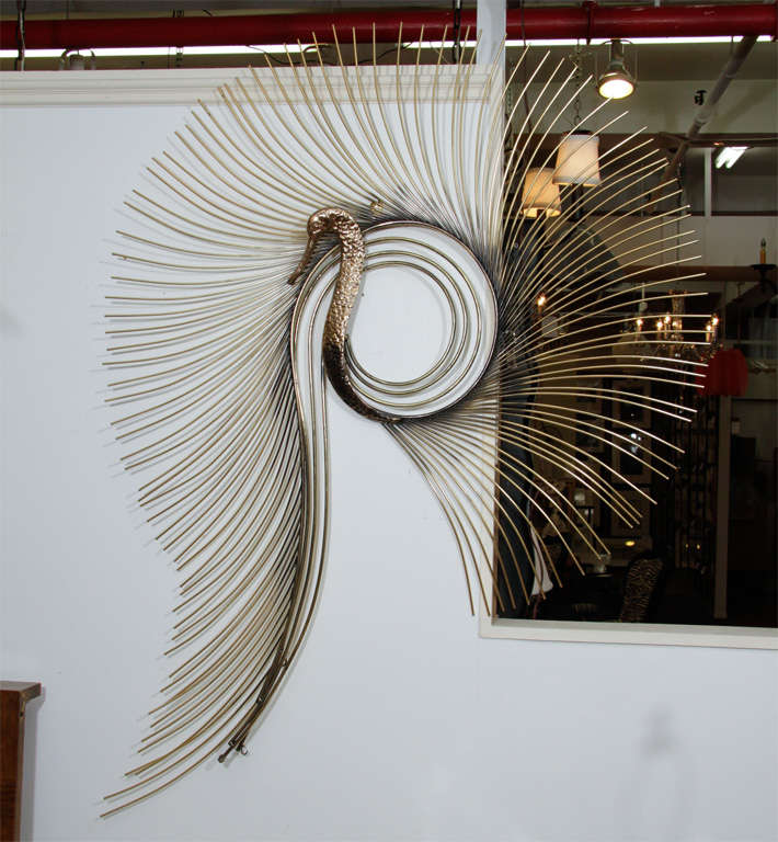 Brass Wall Sculpture of a Perched Peacock with Spiraling Stylized Feathers, Signed by C. Jere.<br />
<br />