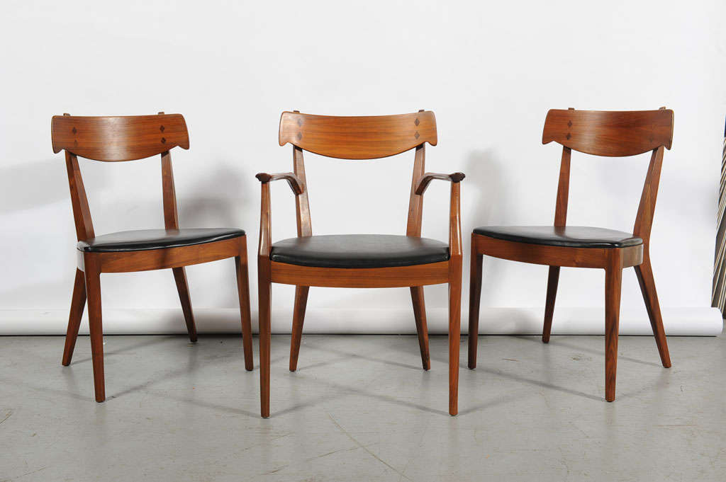 A set of dining chairs designed by Kipp Stewart and Stuart MacDougall for Drexel. Walnut with Rosewood inlay. Priced individually.