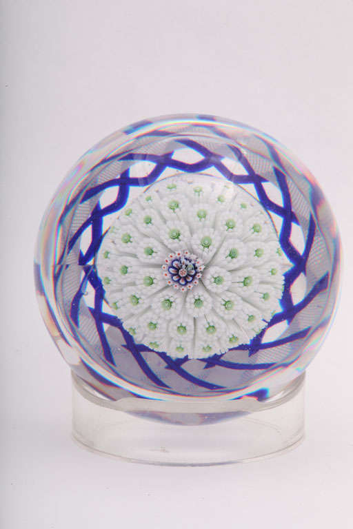 A rare antique Baccarat Bouquet de Marriage, the mushroom paperweight with white star canes with green centers around a central arrowhead cane, blue and white torsade, star cut base