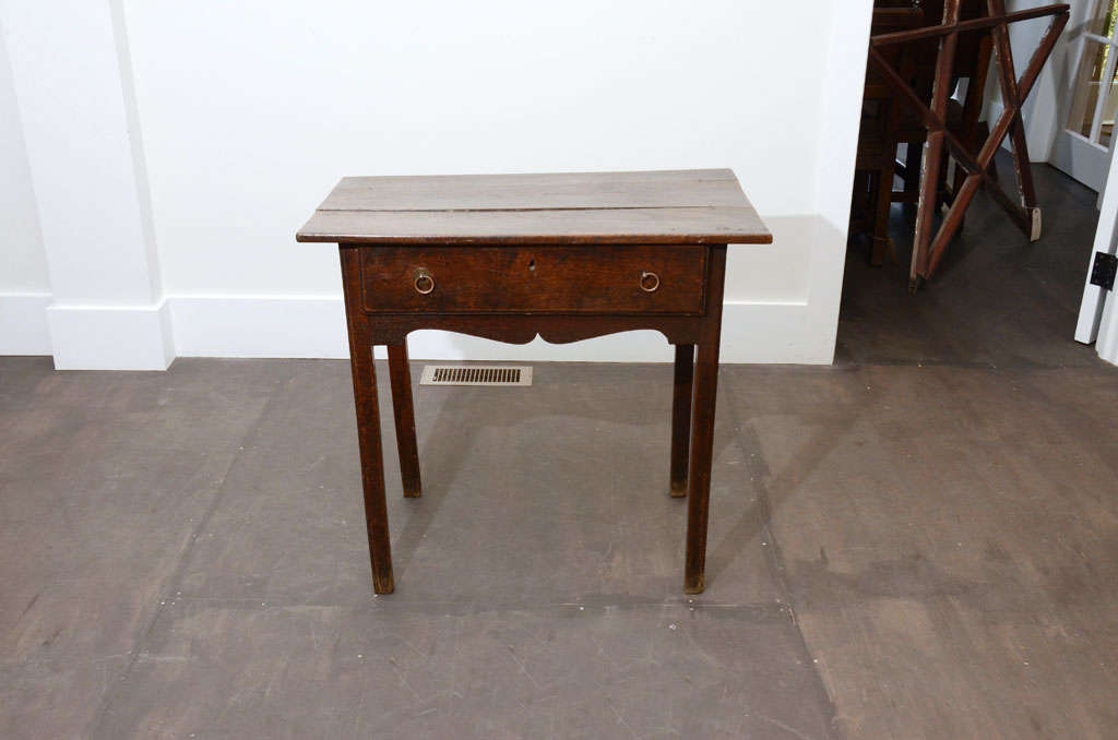 Antique Georgian oak side table with drawer and original brass pulls.