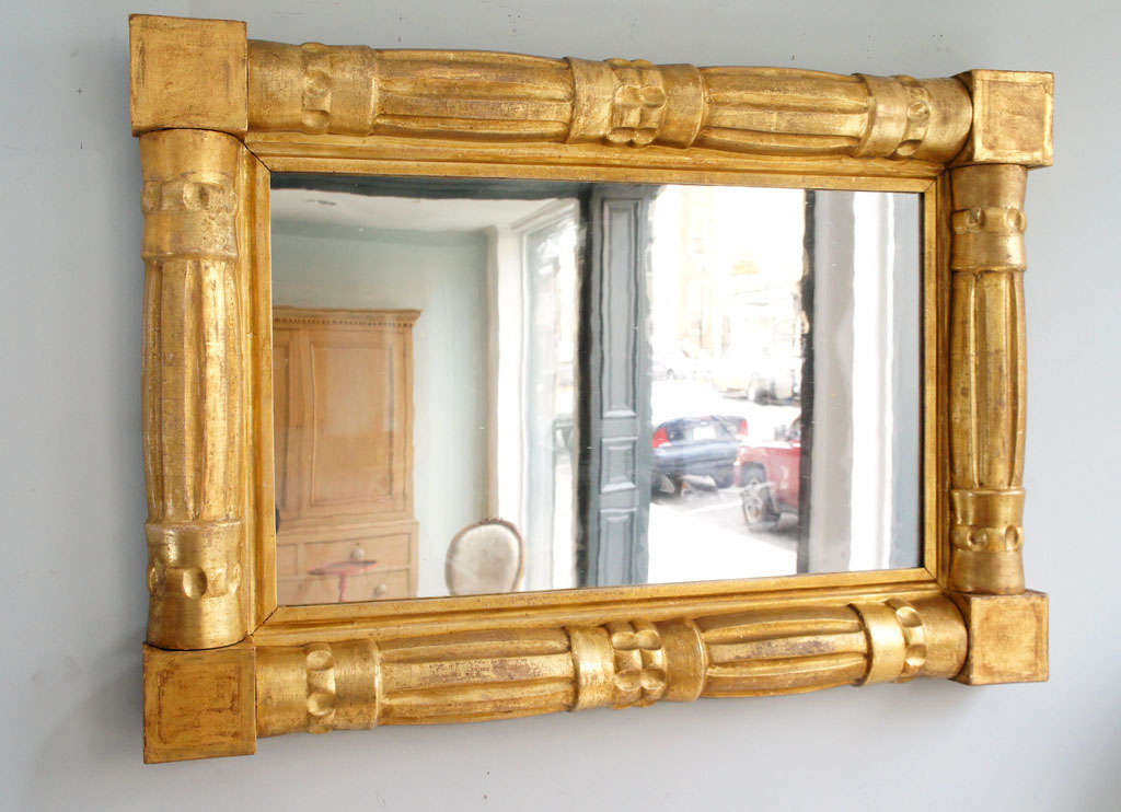 Unusally Graphic and Bold Example of a  an American Empire Pier Mirror (circa 1840). Large Reeded Colums 
and Corner Blocks