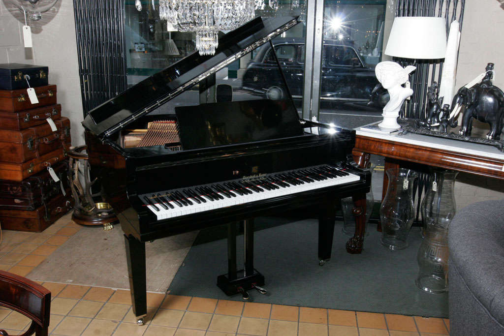 An ebonised English baby grand piano by Marshall and Rose.  Fully overhauled and complete with stool.
Circa.1935
