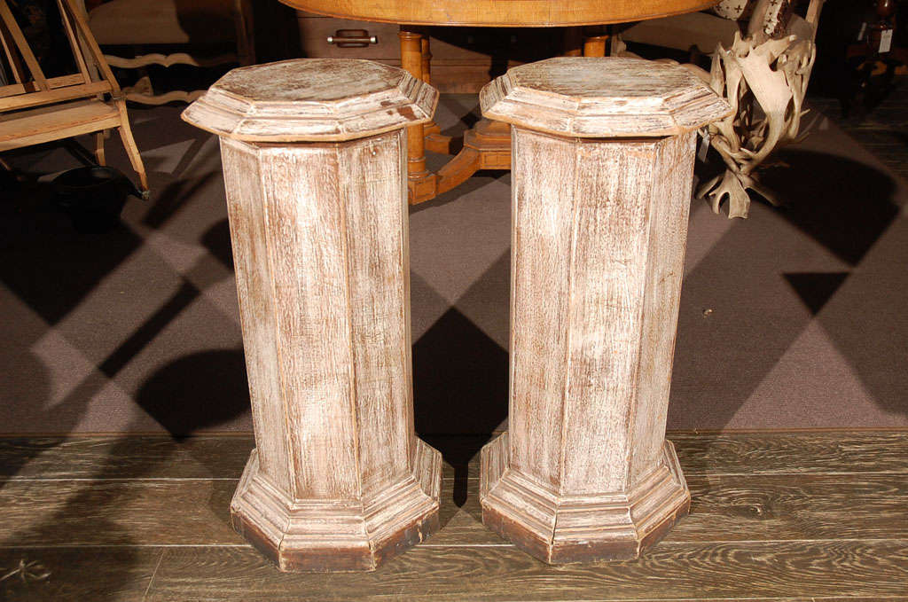 Pair of octagonal beveled top columnar plinths or stands from 19th century England. 