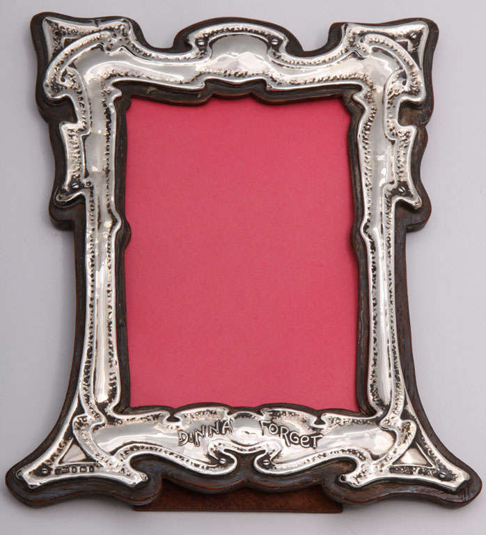 Unusual, Art Nouveau, sterling silver (wood backed) picture frame, Birmingham, England, 1905. Bottom of frame has motto 