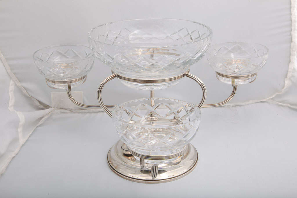 Sterling silver and cut crystal epergne/centerpiece, The Gorham Corp., Providence, Rhode Island, circa 1930's. Epergne measures: 9 1/2 inches high x 17 1/2 inches across x 14 inches deep x 7 inches diameter across weighted base. Central cut crystal