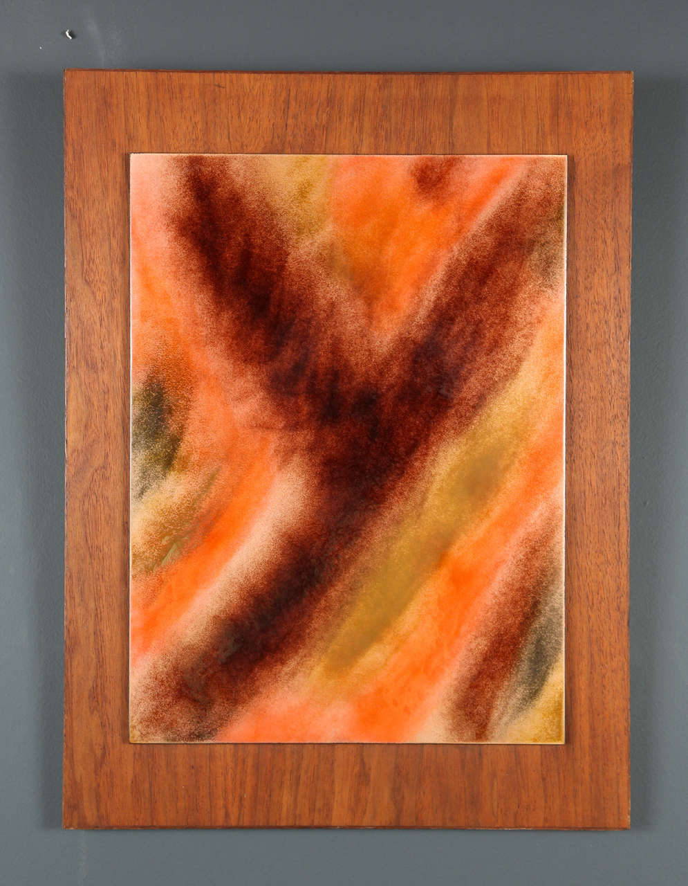 Exquisite pair of high gloss resin panels mounted on walnut wood. The two panels incorporate a mix of orange, yellow, and earth tones in a distinctive abstract pattern.