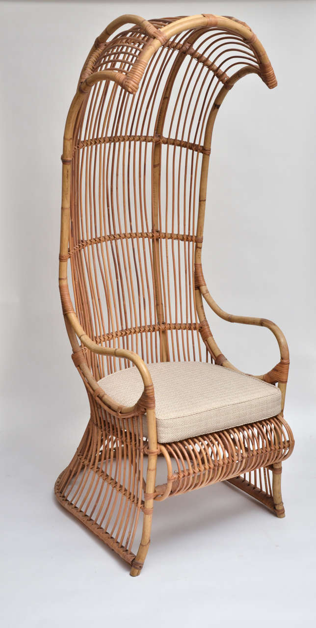 Charming bamboo high back canopy arm chair with upholstered seat cushion.