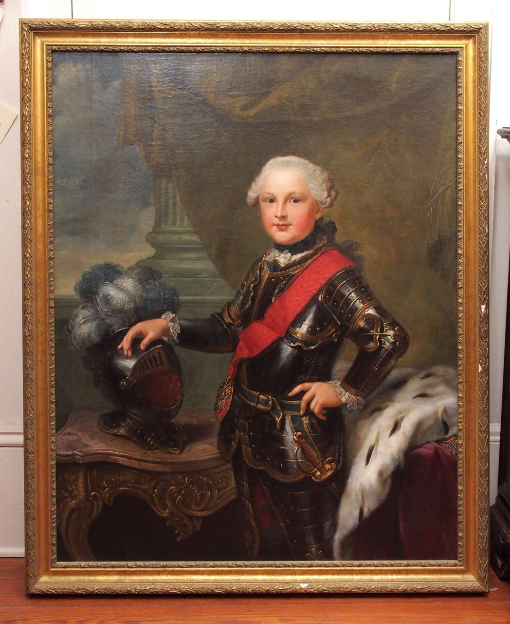 18th century oil on canvas of French boy in armor with console and curtain.
Frame is recent probably 1940s.