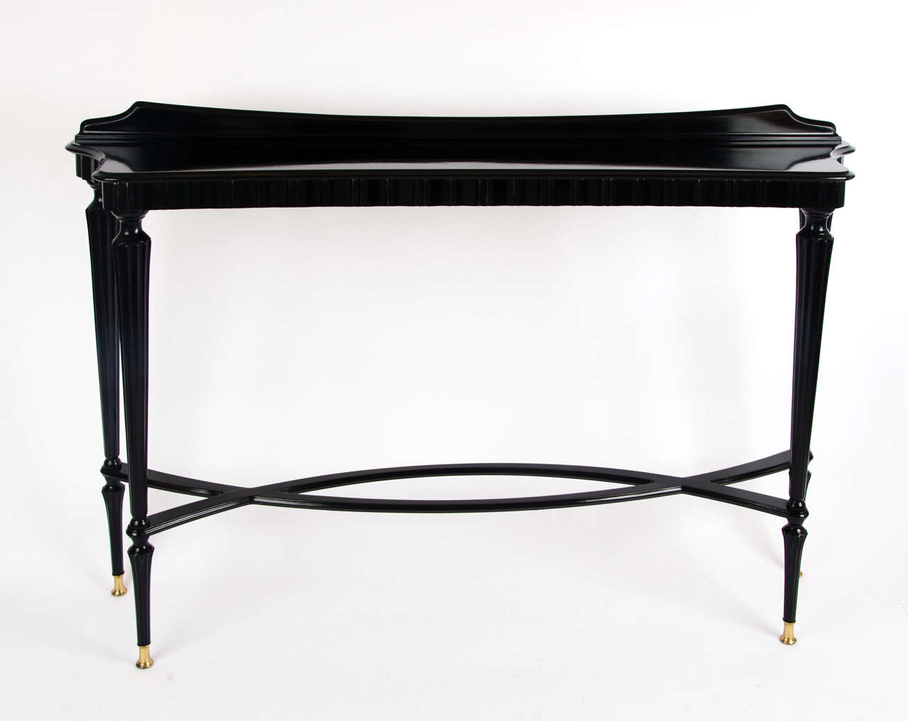 1940s very elegant ebonized mahogany console table with brass feet.