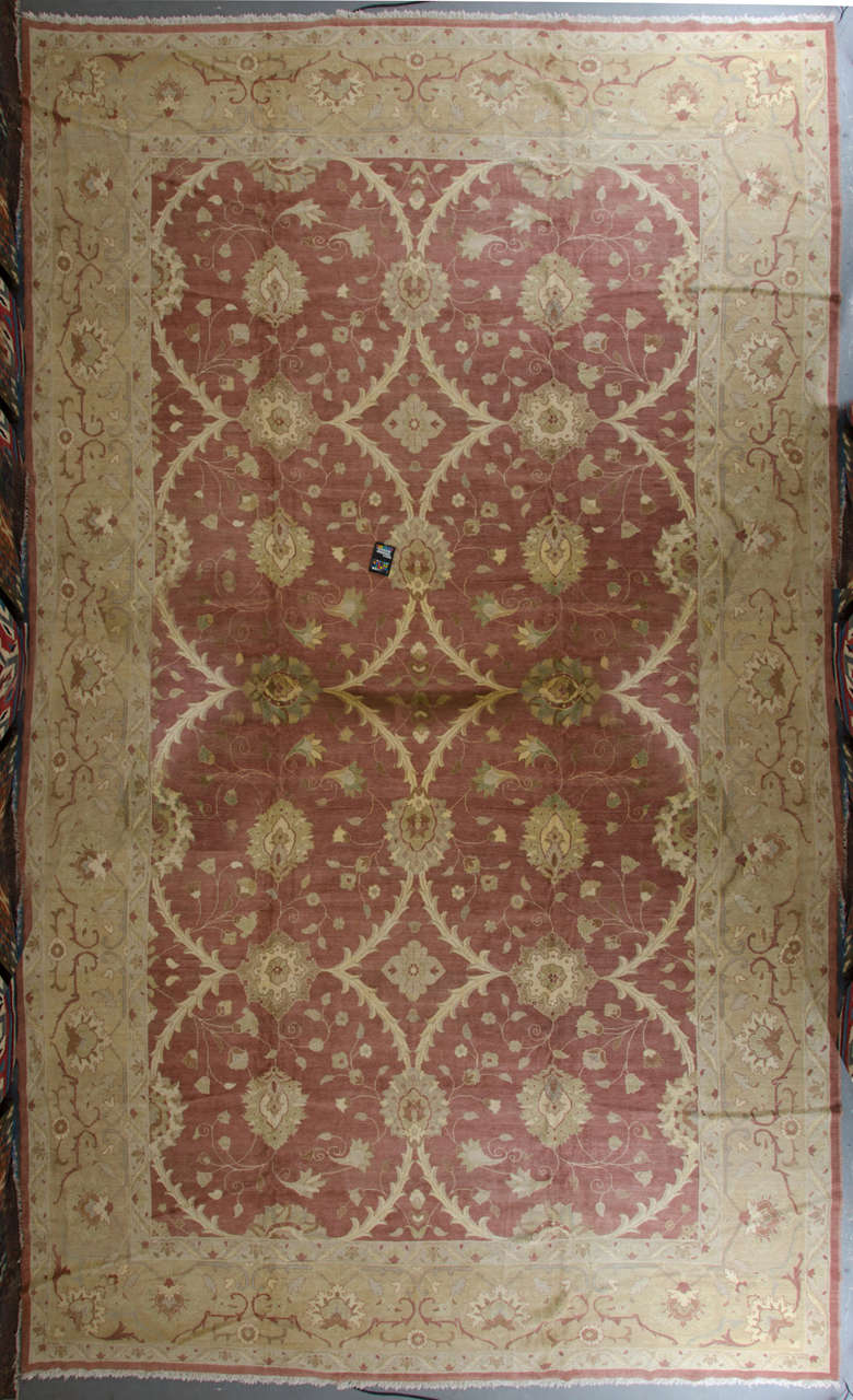 Modern Persian Ziegler. Geometric patterns combined with flowers and leaves. The predominant colour is pink together with sand, also the natural green colour plays an important role.