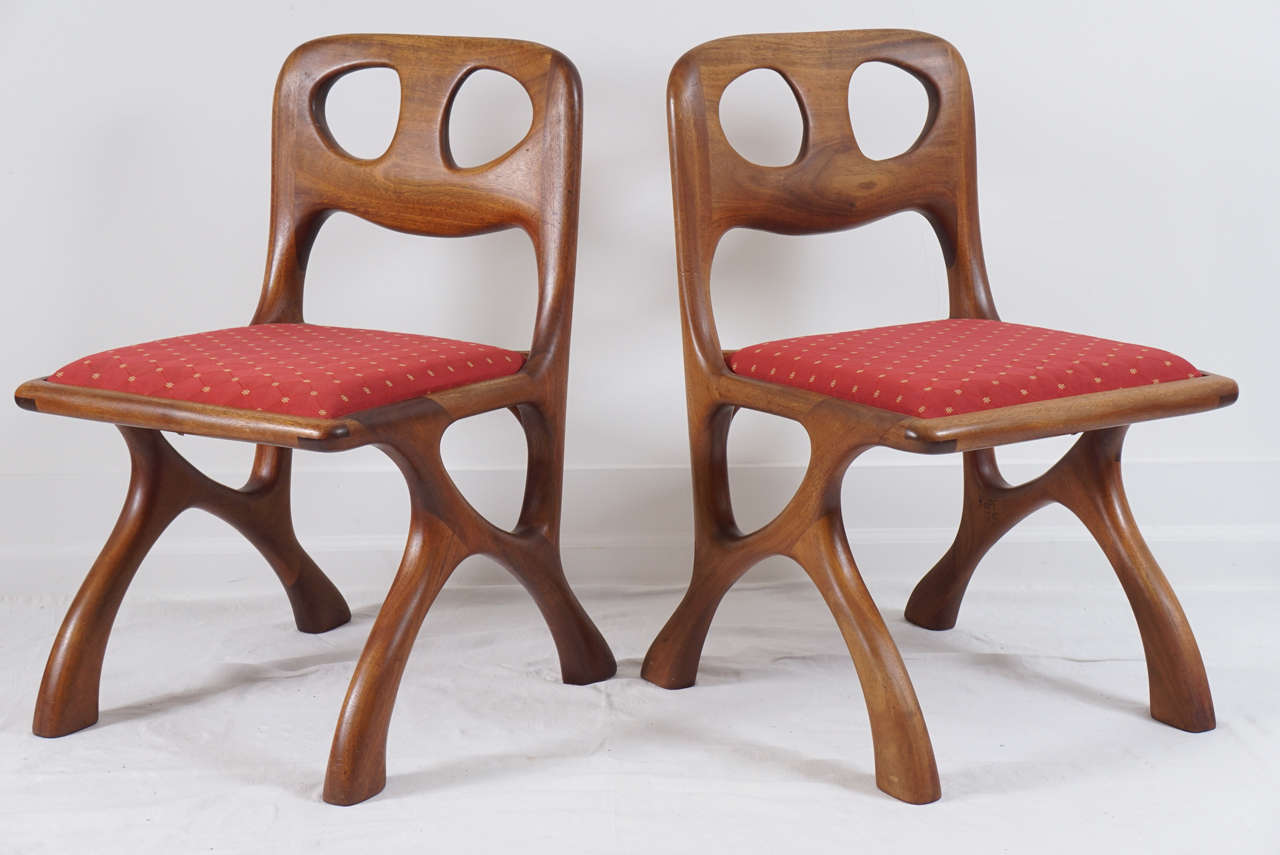 these chairs are really great.
great design and great craftsmanship here.
a bit of Adrian Persal. Kagan, but really unique.
seats have a older fabric which can be changed in a cinch.
each chairs is carved with name and date of creator.
Pictures show