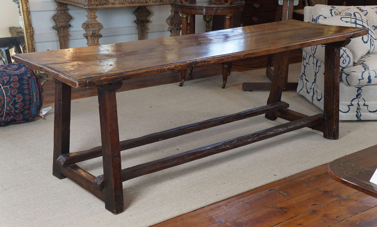 Nice English walnut trestle table. Beautifully aged top having 2 boards that are 2