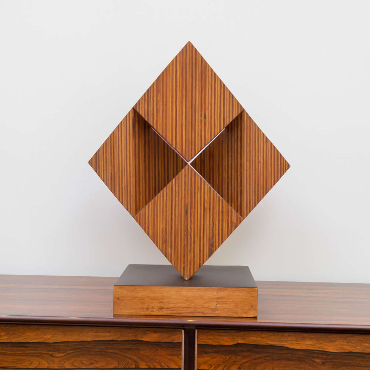 Beautifully executed stacked wood sculpture signed Ray Sells.

