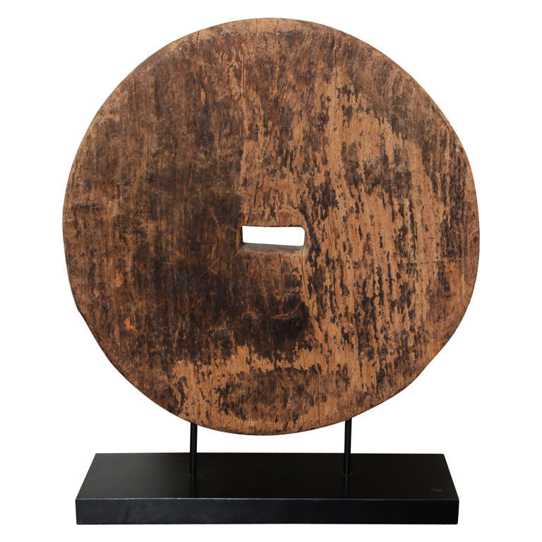turn-of-the-century-mounted-wooden-millstone-at-1stdibs