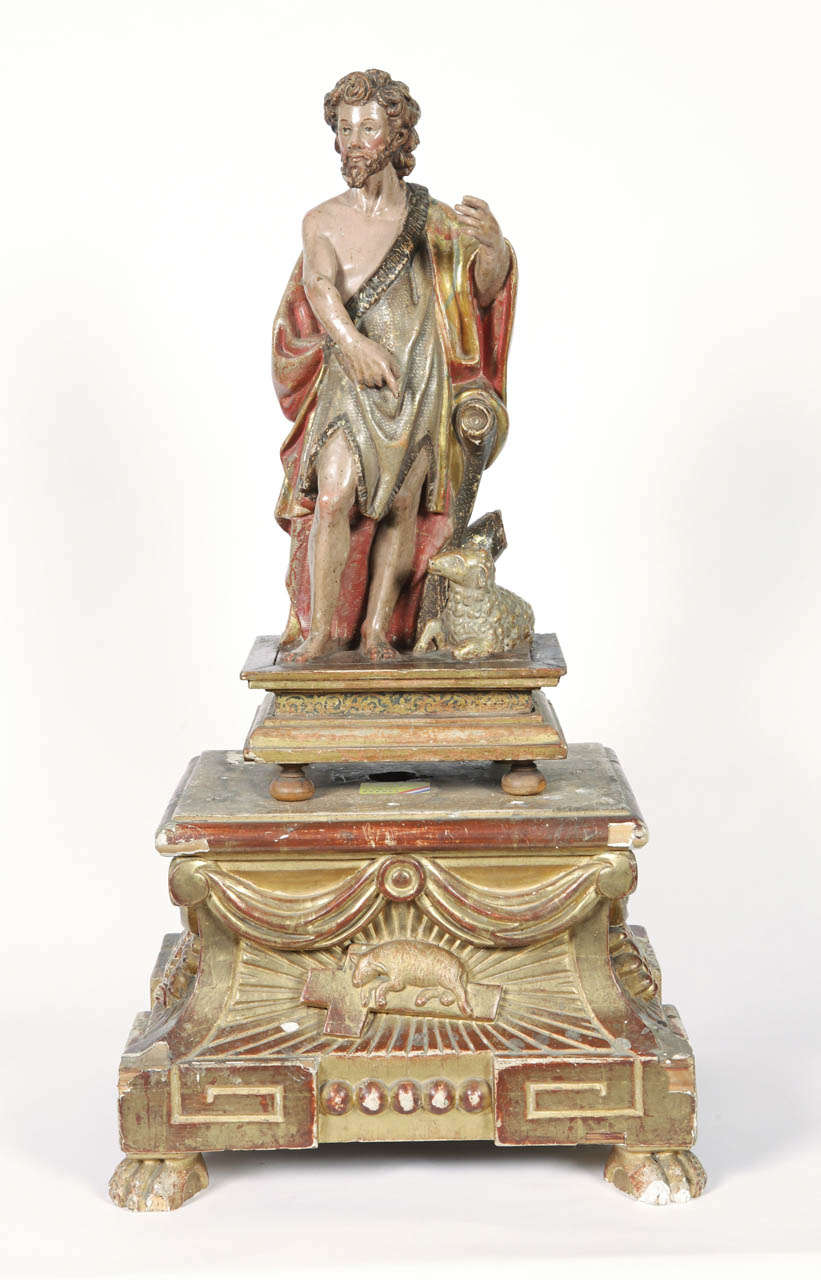 Exquisite antique Italian wooden polychrome figure of St. John the Baptist. Excellent condition with wonderful original painted finish. Two important attributes that distinguish John the Baptist in portraits is the lamb, often lying or standing on a