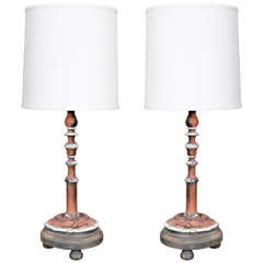 A pair of candlestick lamps with custom shade.