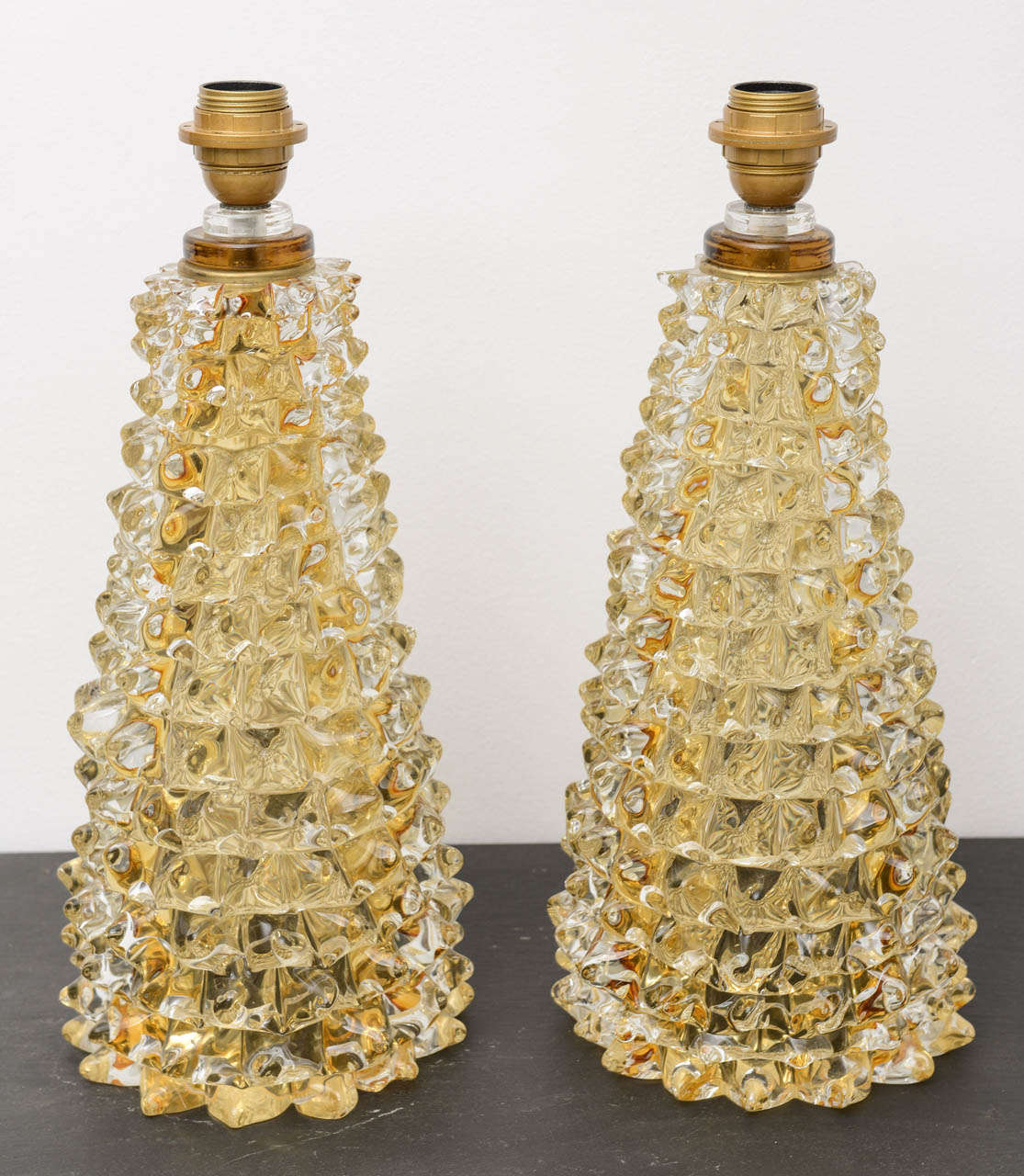 A pair of  rostrato amber Murano glass table lamps,  Italy circa 1970's.

THIS ITEM IS LOCATED IN MANHATTAN AT 1STDIBS@NYDC SHOWROOM. 
200 LEXINGTON AVE - 10TH FLOOR, NYC