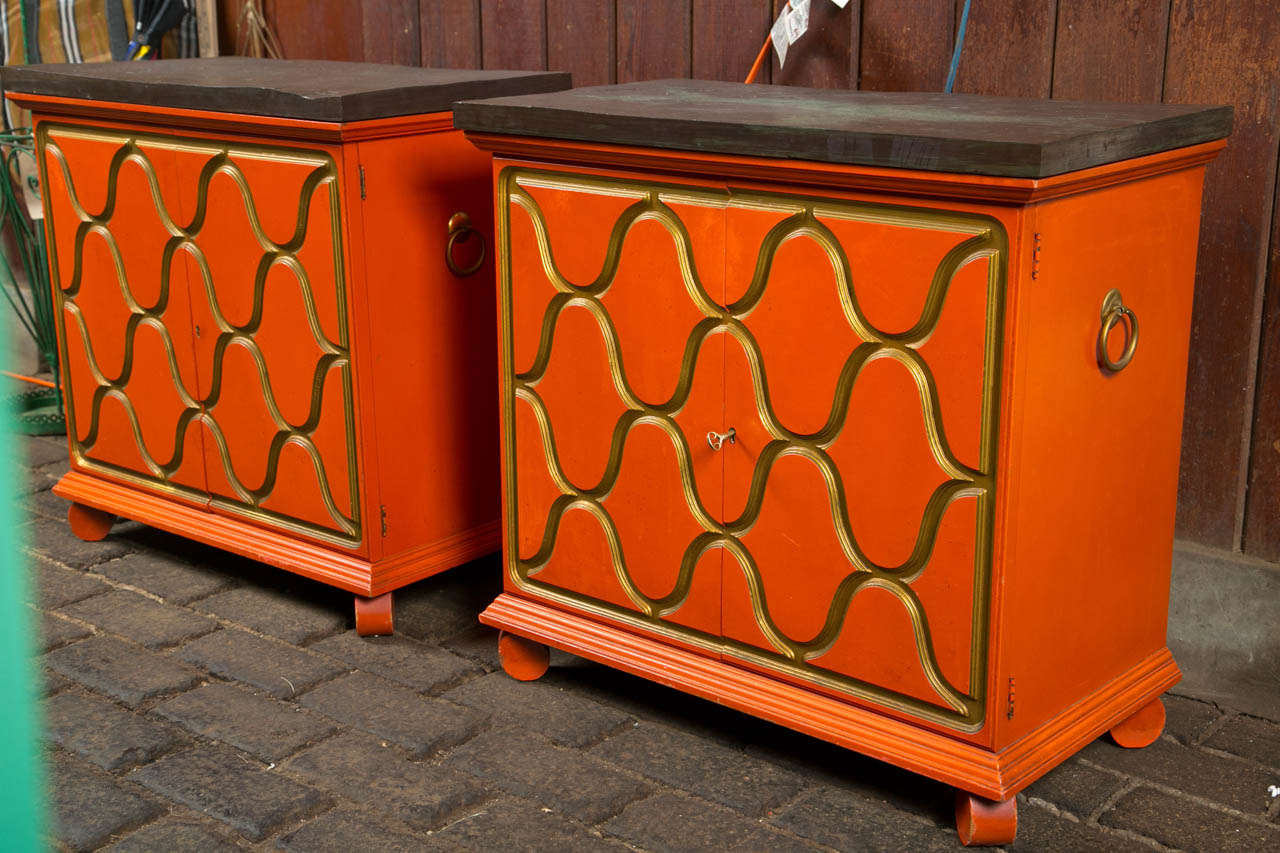 Stunning pair of Dorothy Draper designed Heritage, Henredon chests in original orange and gold finish. Tops are slate.