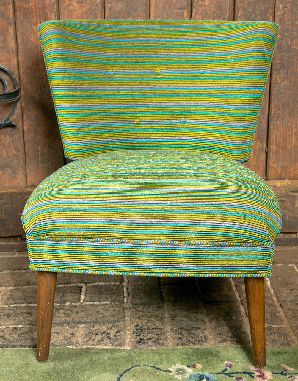 Newly upholstered midcentury modern slipper chair in Osbourne and Little fabric. Seat depth is 19.5