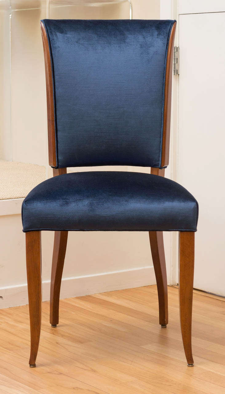 Upholstered in a lustrous sapphire silk velvet. Mid-century French dining chairs with a French Polish Mahogany frame. 2 chairs available in this style, priced individually.