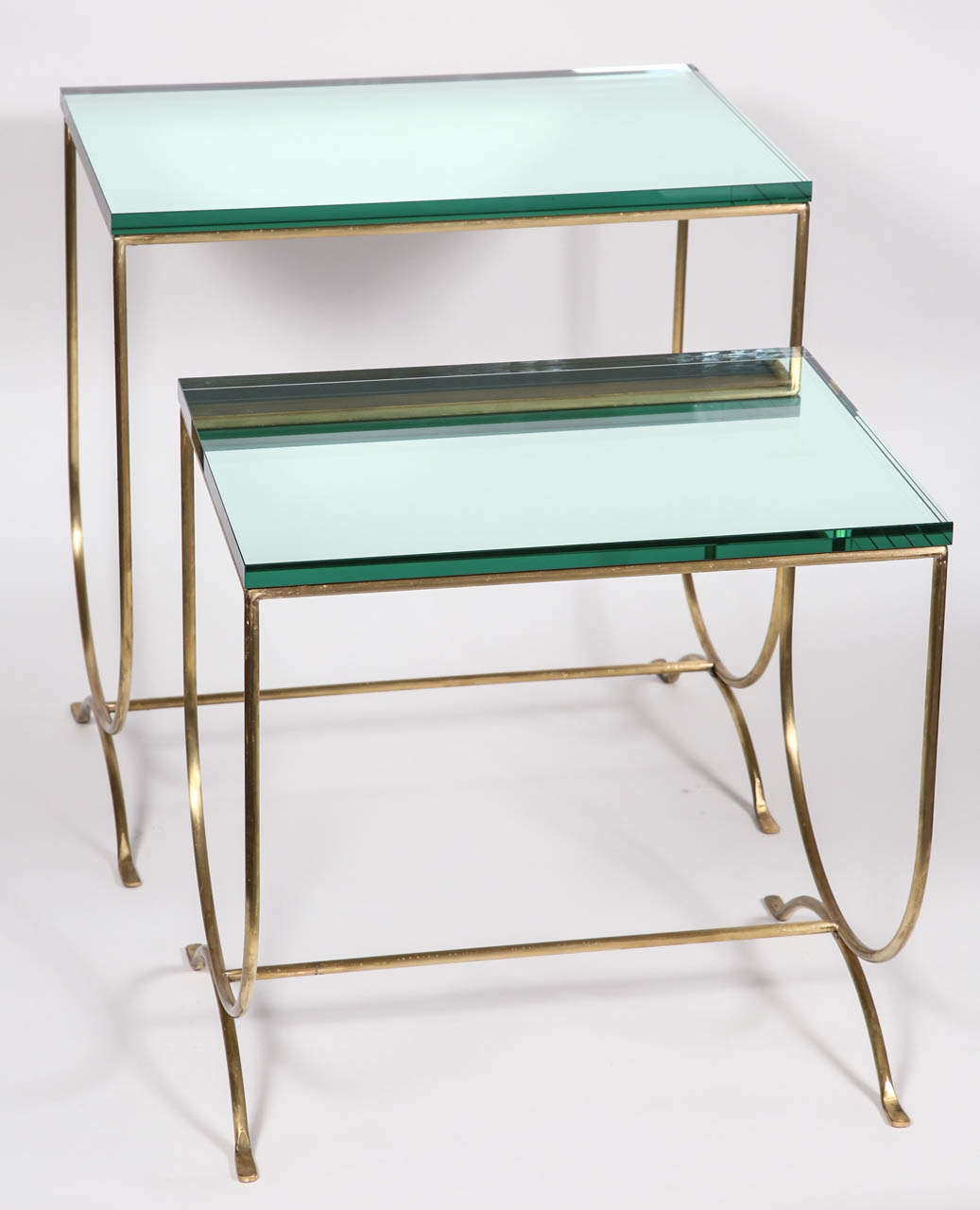 Surface is 3/4 inch straight polished mirror glass; base is solid brass; circa 1970s; dimensions: Lg table - 25'' H x 16'' D x 21'' W - Sm. Table is 21'' H x 16'' D x 21'' W.