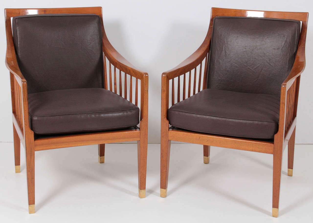 A pair of Danish walnut armchairs designed by Peter Hvidt and Orla Molgaard Nielsen and made by cabinet maker Ludvig Pontoppidan, Ca 1946, with rectangular slat back and sides, loose upholstered cushions, raised on square tapered legs ending with