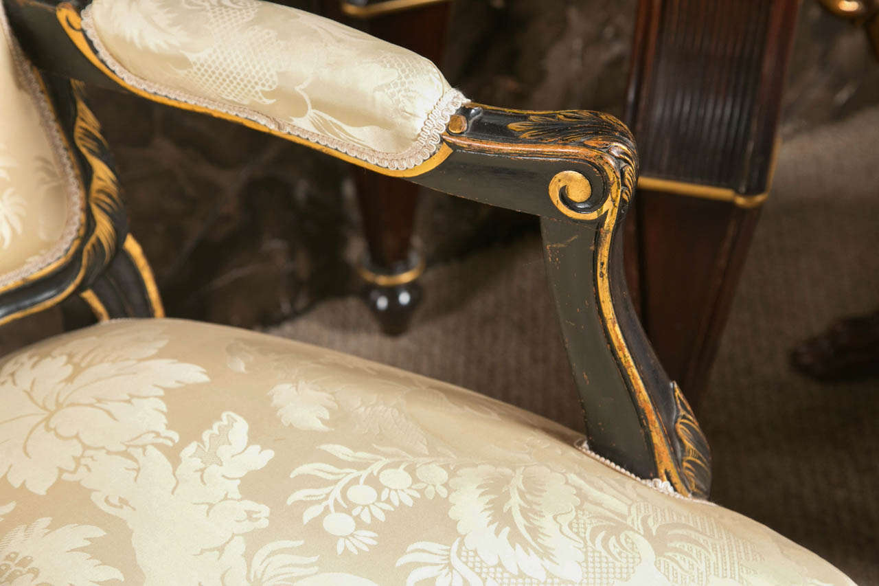 Pair of French Fauteuils Louis XV Style Armchairs Ebonized And Parcel Gilt In Good Condition In Stamford, CT
