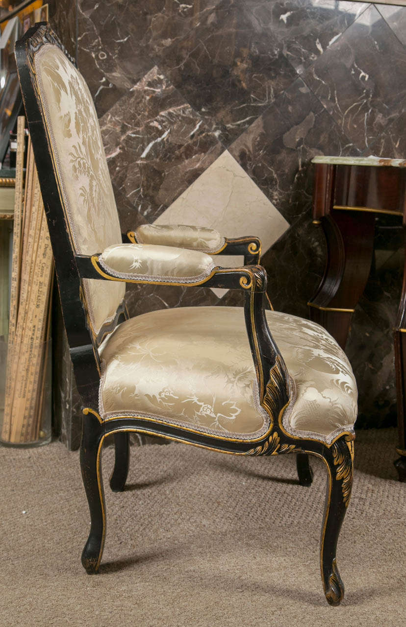 Wood Pair of French Fauteuils Louis XV Style Armchairs Ebonized And Parcel Gilt