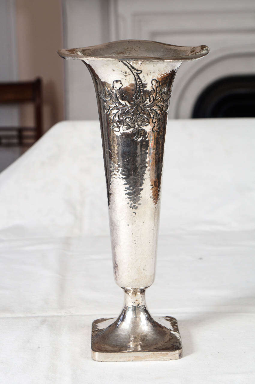 Silver plated Victorian trumpet form vase with raised, hammered detailing of leaves on the front. 4