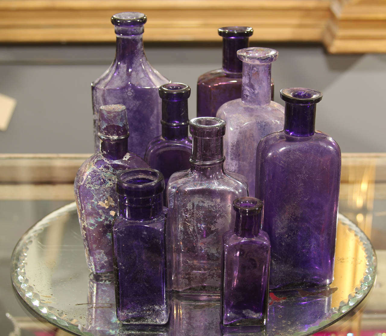 large group of 9 purple bottles in assorted size and shape.  mid to late 1800's, lovely colors
