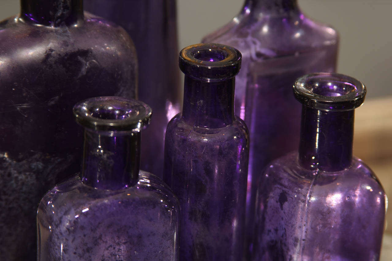 purple glass bottles antique