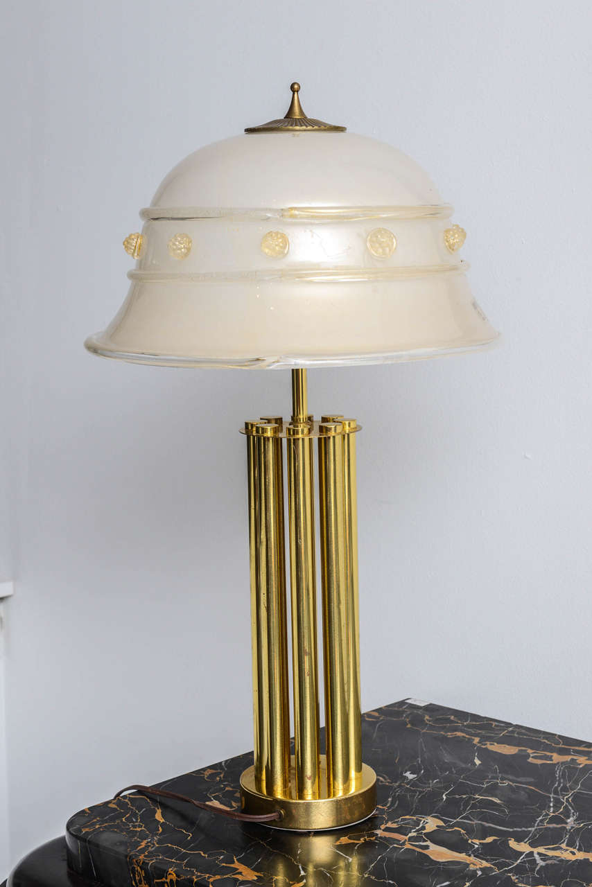 Mid-Century Murano Vetri by Barovier & Toso glass and bronze table lamp.
Mushroom shaped and transparent Murano gold and white blown glass top.
The base is in bronze tubes 
two bulbs,
Wired for USA.