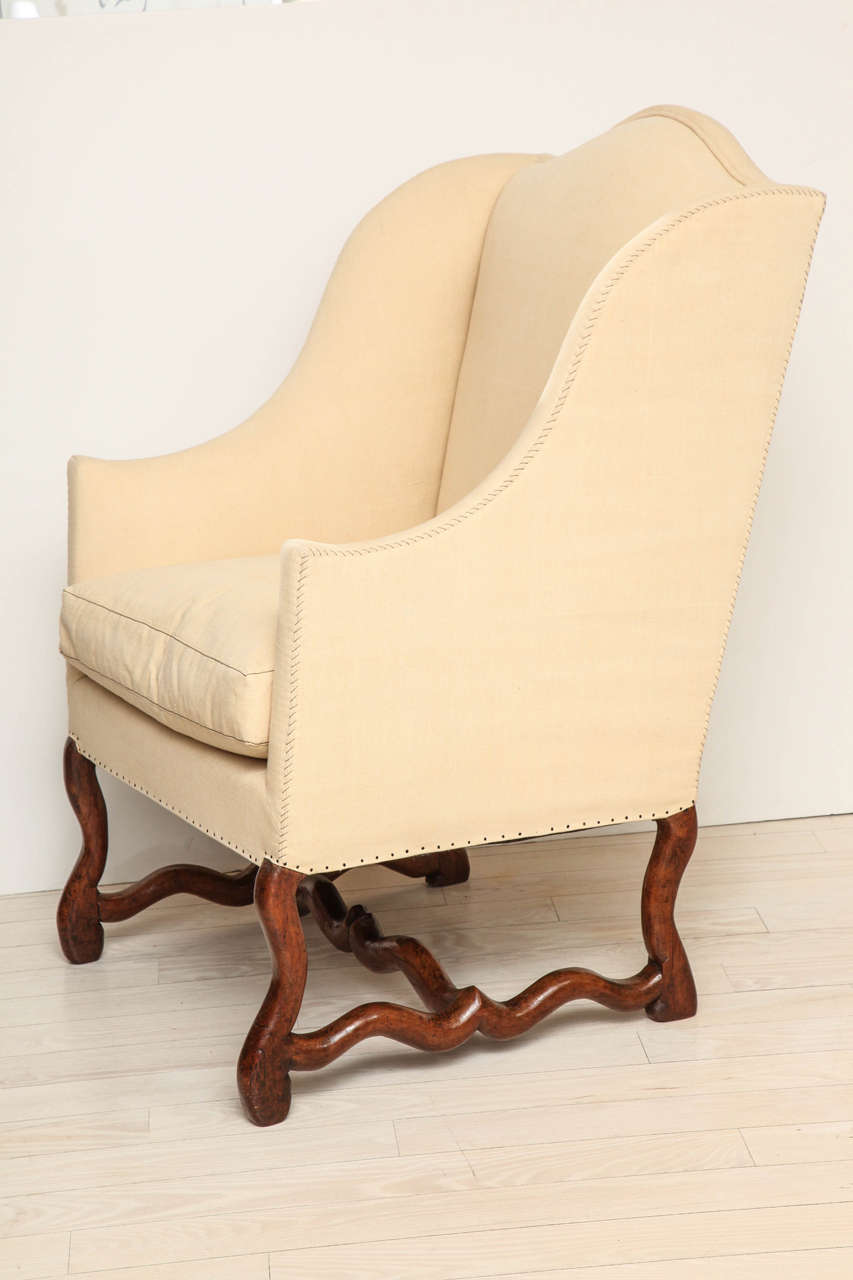 18th century upholstered wing chair with walnut 