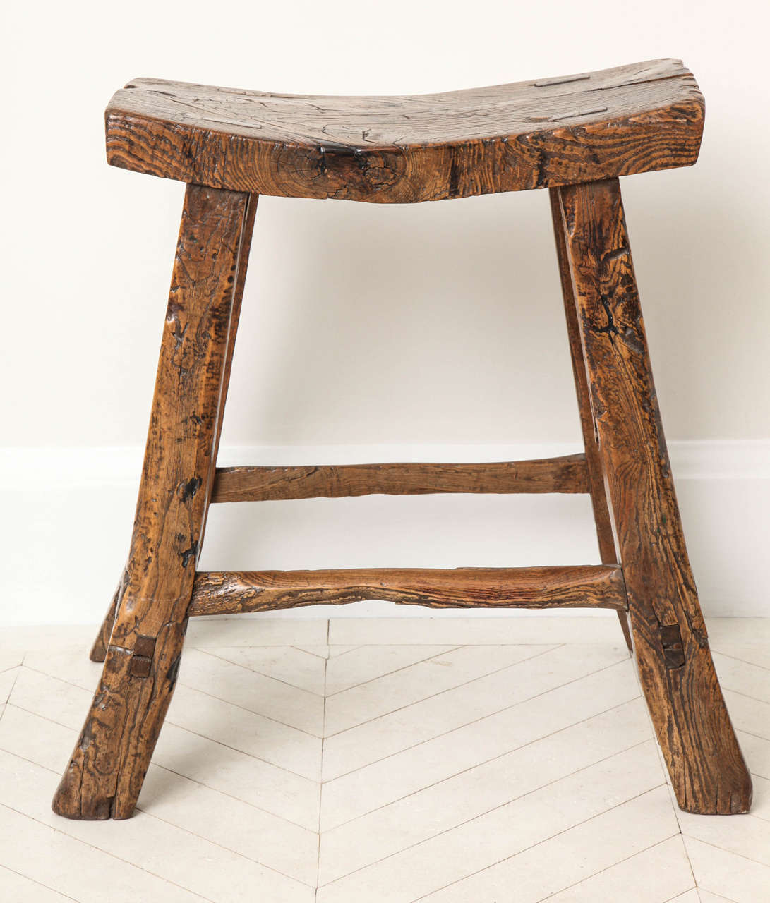 A 19th century Chinese elm wood stool In Excellent Condition In New York, NY