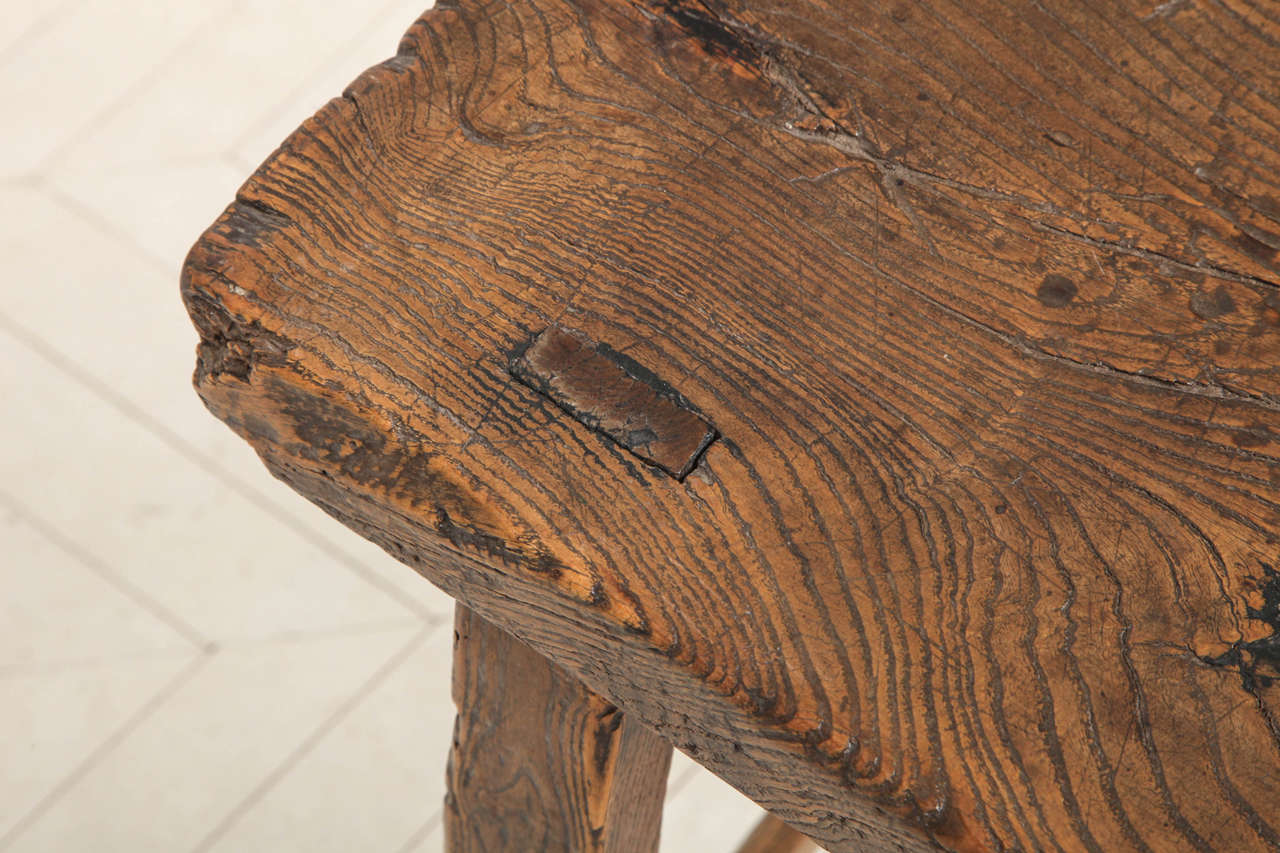 A 19th century Chinese elm wood stool 1