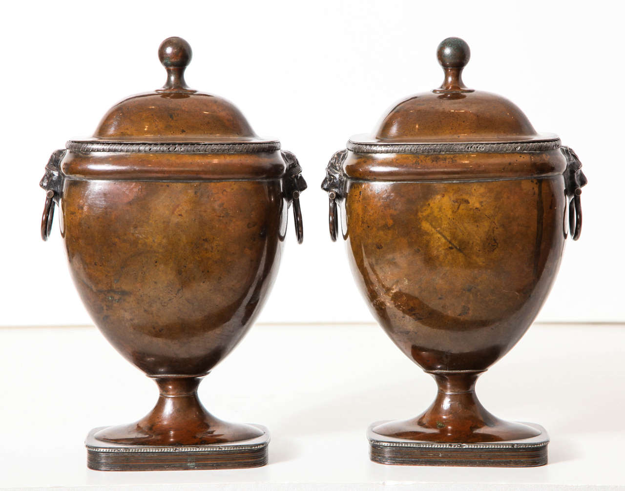 A Pair of 19th century English silvered copper covered urns