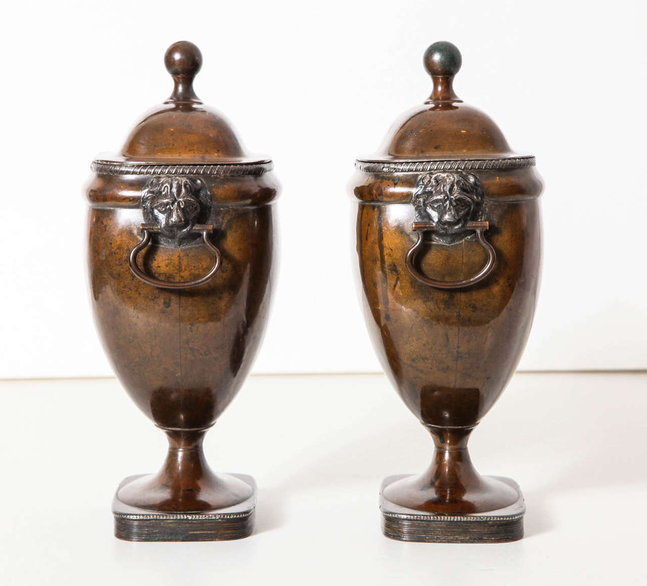 Silver Plate A Pair of 19th century English silvered copper covered urns