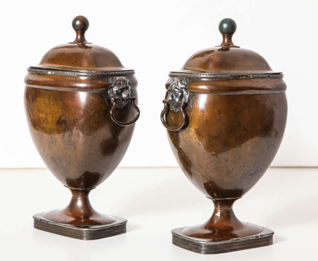 A Pair of 19th century English silvered copper covered urns 1
