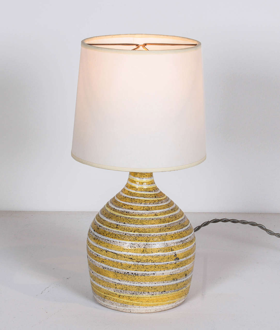 French ceramic lamp, circa 1960.
Shades of yellow, gray and white glaze.

Signed: With Logo and 1665.