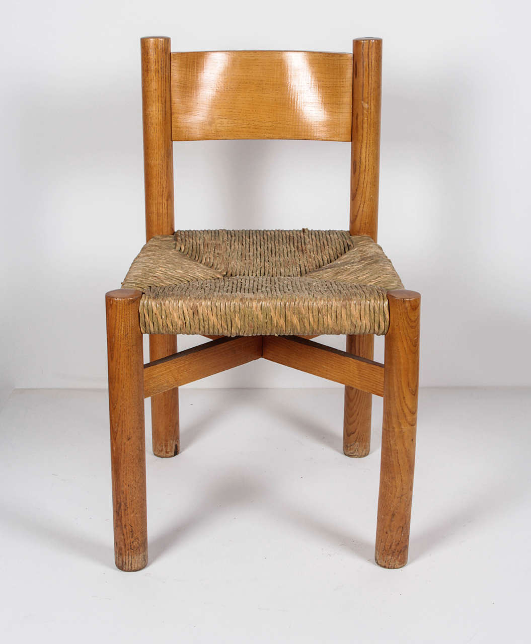 Charlotte Perriand, circa 1967.
Chair in oak with rush seat.