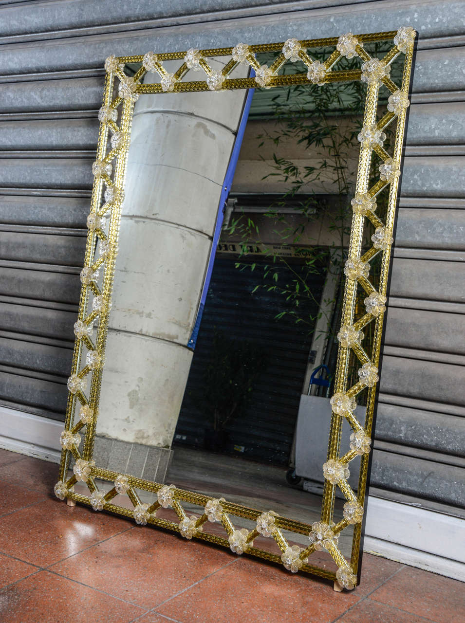 Mirror with Murano glass.