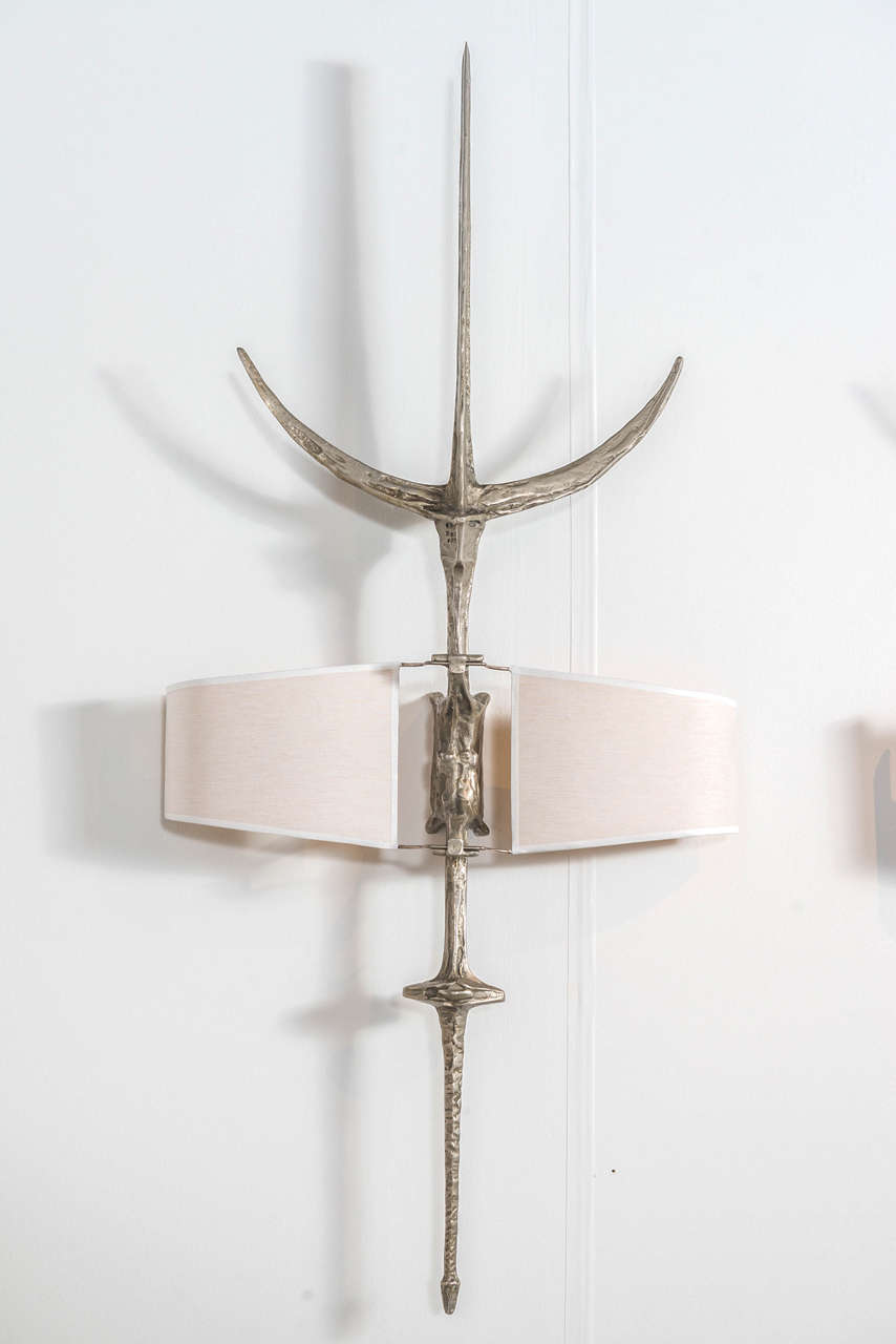 "Hallebarde"  -  An exceptional and rare pair of nickeled-bronze wall sconces.
Signed F. Agostini on reverse.
Designed in 1968-1969.
Provenance:  Private collection France.