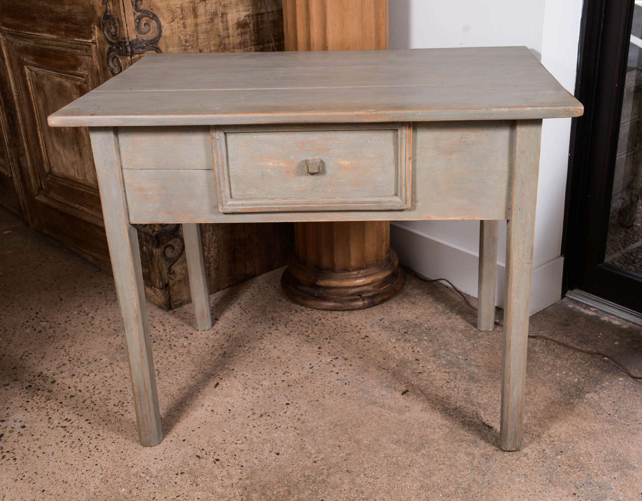 Early 19th century Spanish table with one drawer, tapered legs and later paint.