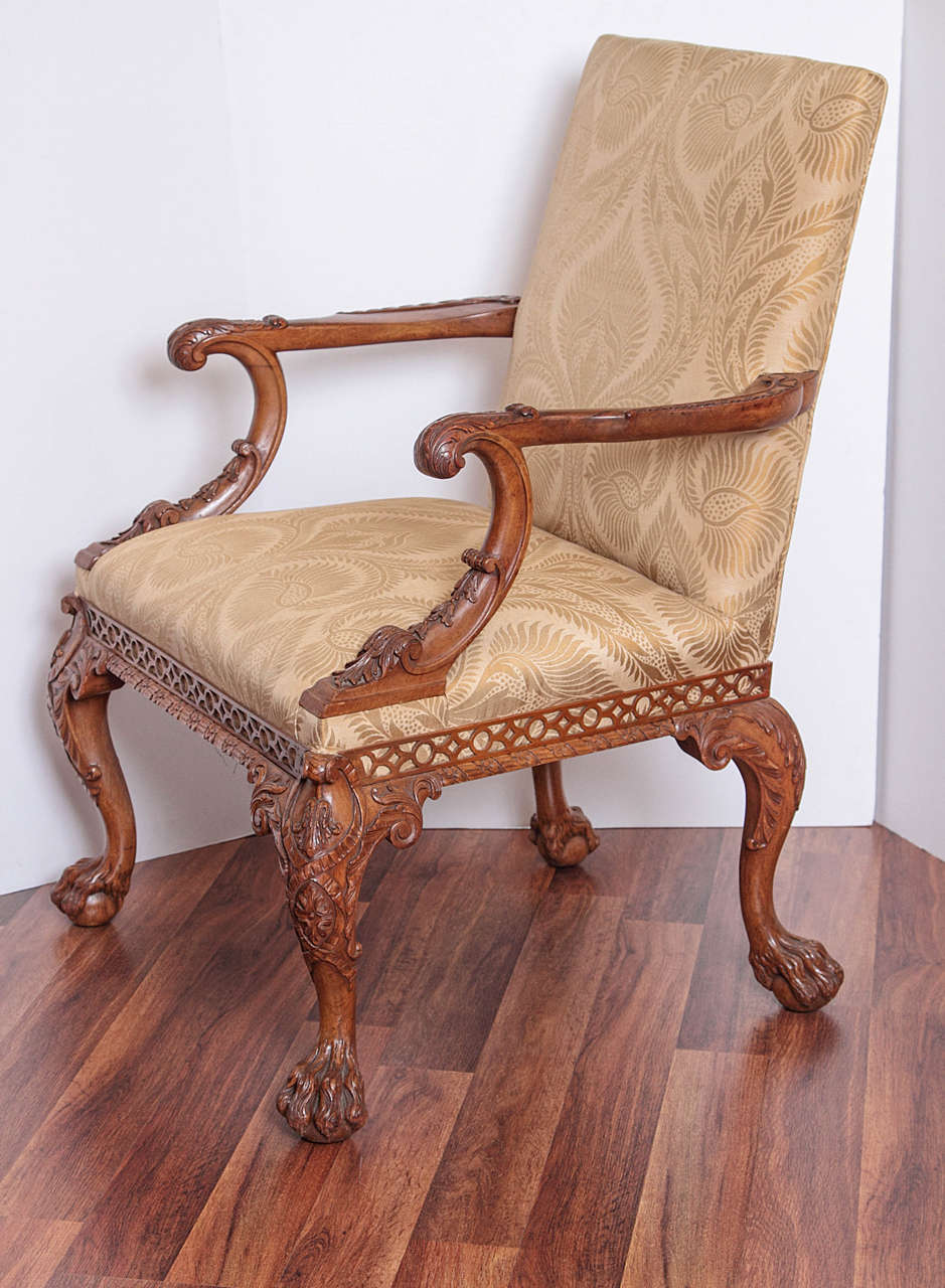 Pair of finely carved rare 19th century Irish Chippendale open armchairs.
