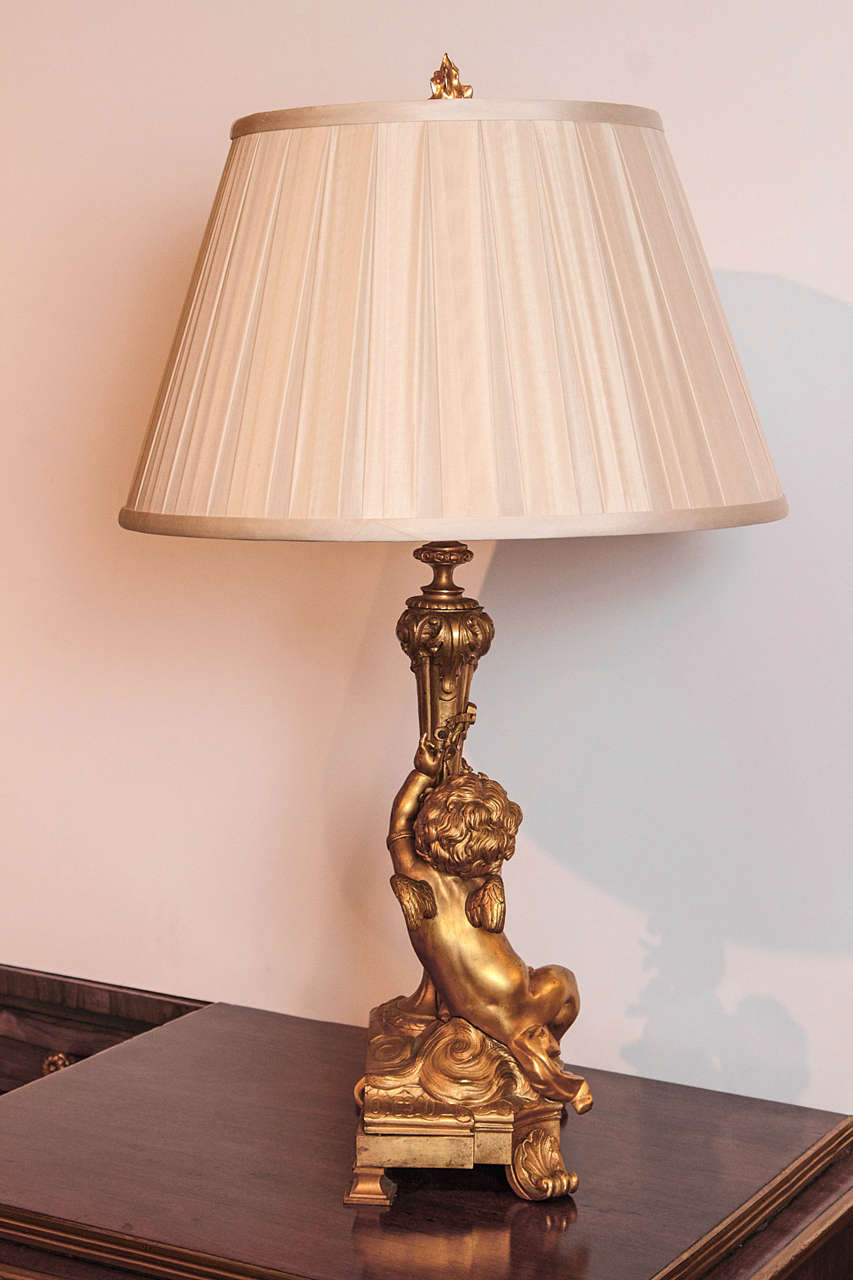 19th c French bronze dore cherub lamps .