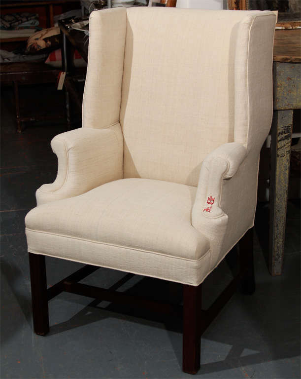 Very comfortable small-scale wing back newly upholstered in French linen.