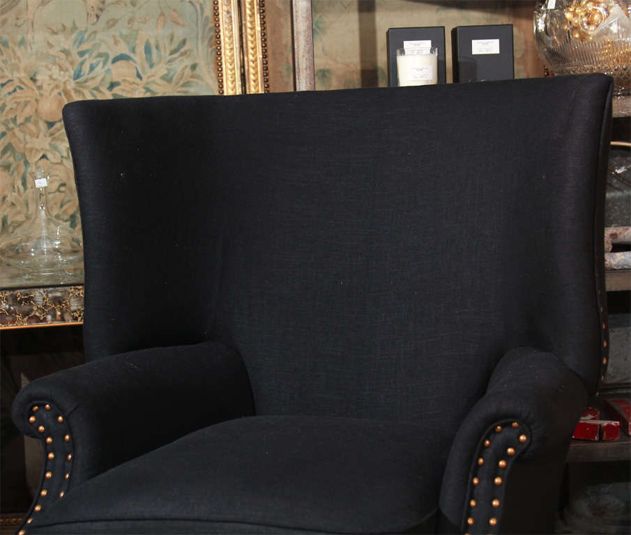 Mid-20th Century black linen and nailhead wingback chair