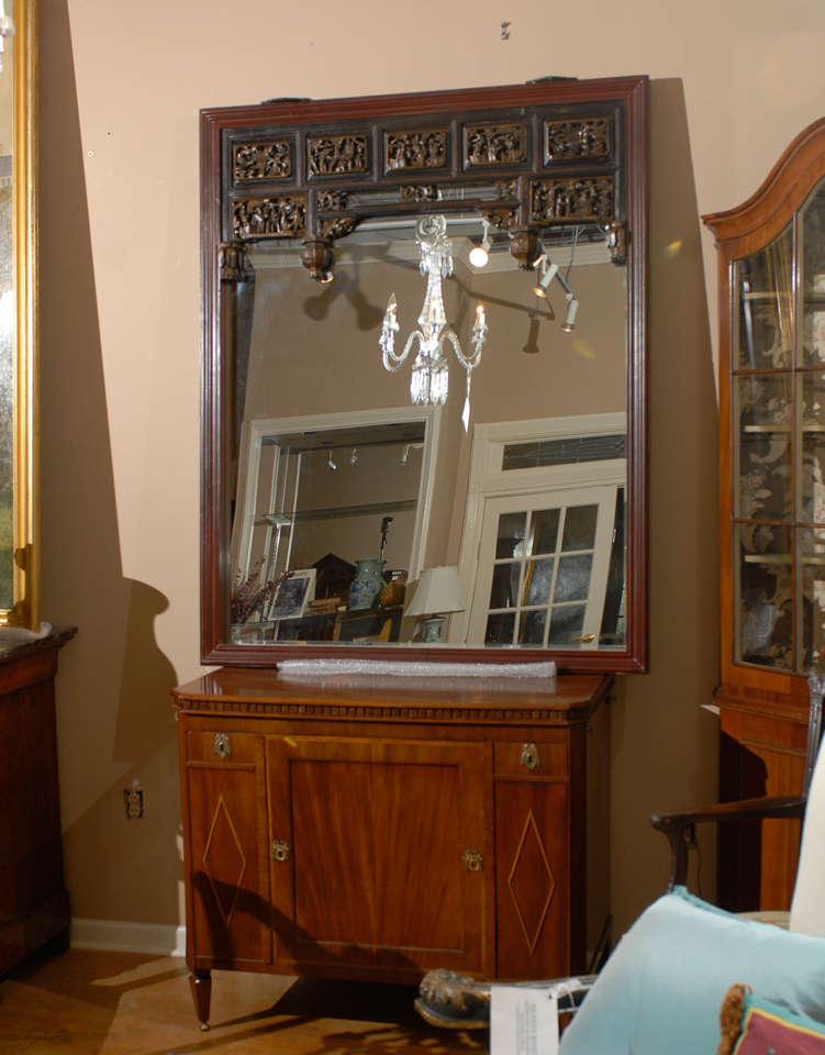 The inset portion of this lovely mirror is hand carved camphor with slight gilt detailing.