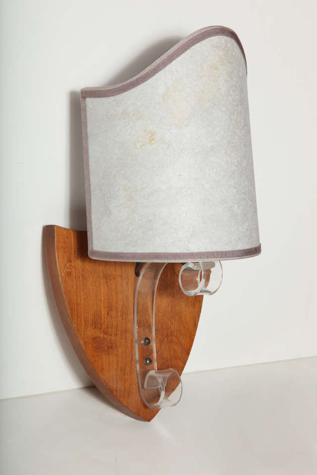 1940s shield-style wall light with Lucite arm and wood wall plate. Clip-on shield-style shade is made from grey parchment trimmed in brown grosgrain ribbon. Standard 40-watt bulb. Must be hardwired. On/Off switch on socket. Shade clips to bulb. New